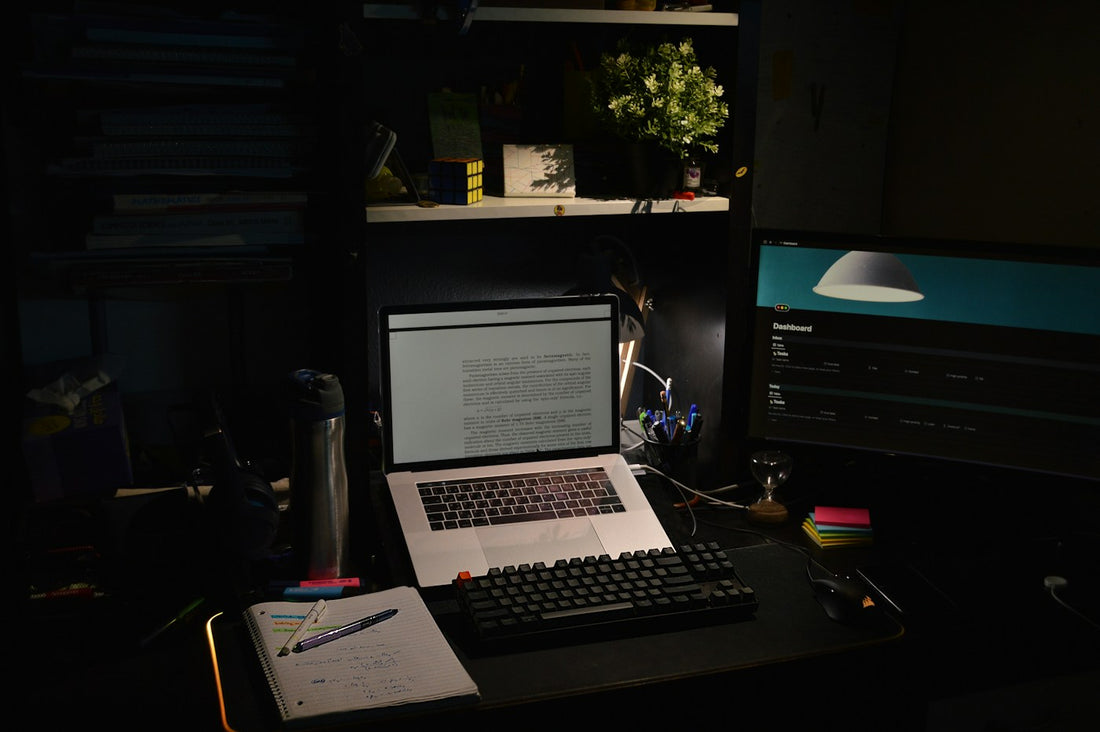 A focused desktop setup with laptop and monitor